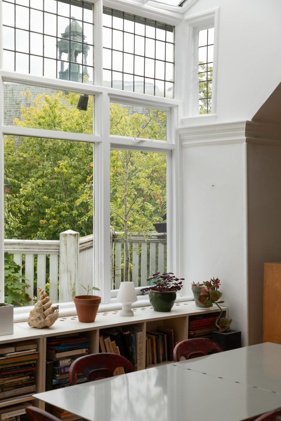 Restored and repainted bay window with leafy outlook