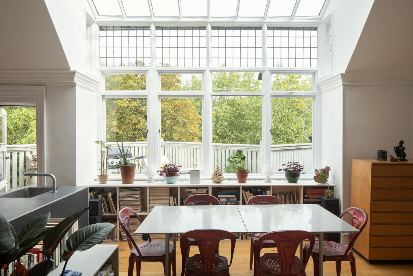Garden dining room with full-height glazing and restored windows