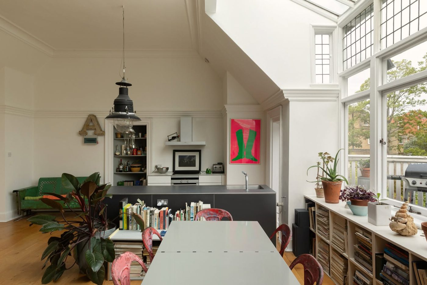 Bright open-plan garden room and kitchen with full glazing