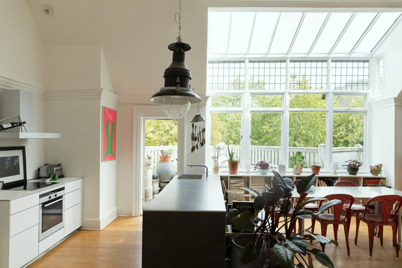 Kitchen and dining area with island and conservatory glazing